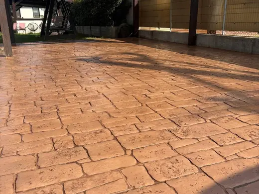 Stamped concrete in an antique cobble pattern with small rough stones, photo 6