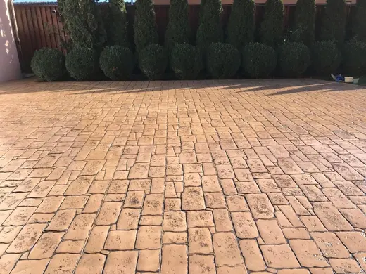 Stamped concrete in an antique cobble pattern with small rough stones, photo 12
