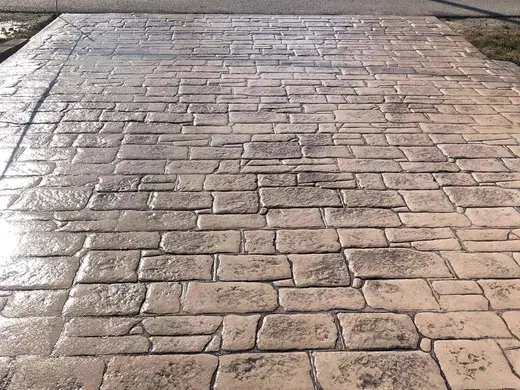 Stamped concrete in an antique cobble pattern with small rough stones, photo 16