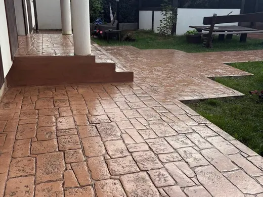 Stamped concrete in an antique cobble pattern with small rough stones, photo 20