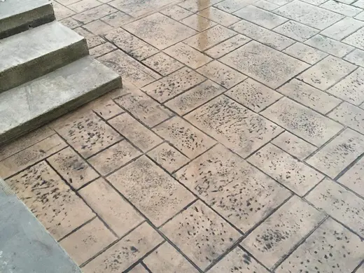 Stamped concrete in a tile pattern with pitted texture, photo 3