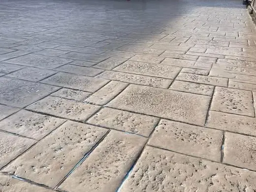 Stamped concrete in a tile pattern with pitted texture, photo 5