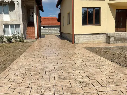 Stamped concrete in a tile pattern with pitted texture, photo 7