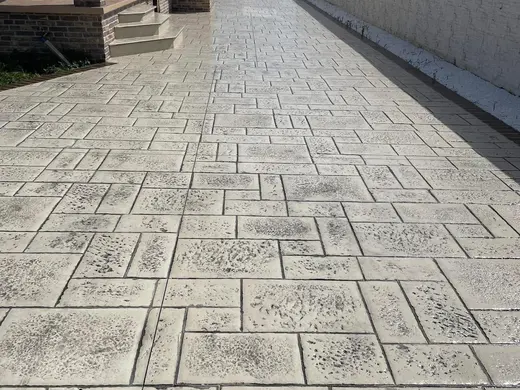 Stamped concrete in a tile pattern with pitted texture, photo 8