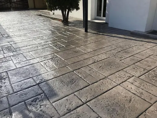 Stamped concrete in a tile pattern with pitted texture, photo 10