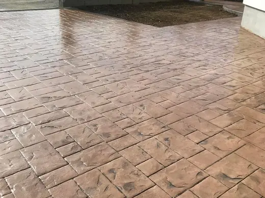 Stamped concrete in a tile pattern with pitted texture, photo 11