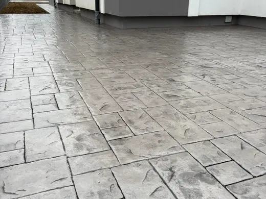 Stamped concrete in a tile pattern with pitted texture, photo 12