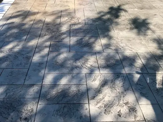 Stamped concrete in a tile pattern with pitted texture, photo 13