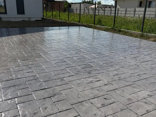 Stamped concrete in a tile pattern with pitted texture, photo 15