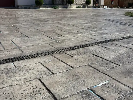 Stamped concrete in a tile pattern with pitted texture, photo 16