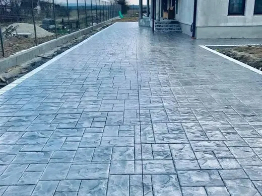 Stamped concrete in a tile pattern with pitted texture, photo 18