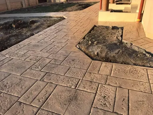 Stamped concrete in a tile pattern with pitted texture, photo 19