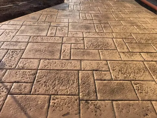 Stamped concrete in a tile pattern with pitted texture, photo 20