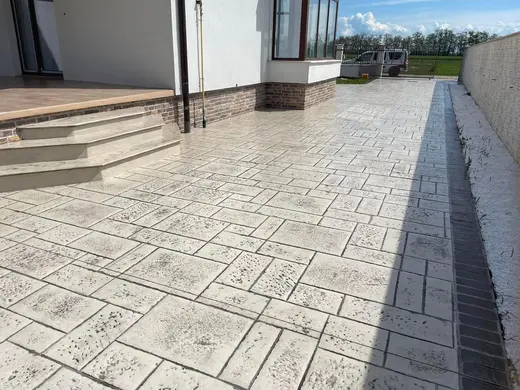 Stamped concrete in a tile pattern with pitted texture, photo 23