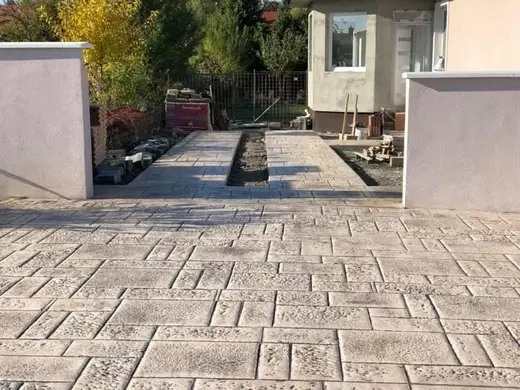 Stamped concrete in a tile pattern with pitted texture, photo 25