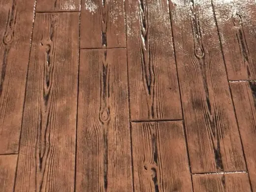 Stamped concrete in a wood plank look with grain, photo 1