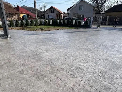Stamped concrete with a continuous stone texture and no joints, photo 1