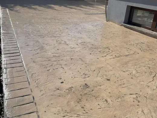 Stamped concrete with a continuous stone texture and no joints, photo 2