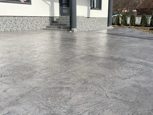Stamped concrete with a continuous stone texture and no joints, photo 5