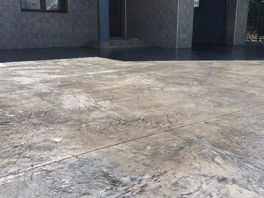 Stamped concrete with a continuous stone texture and no joints, photo 6