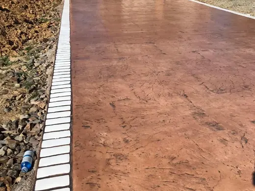 Stamped concrete with a continuous stone texture and no joints, photo 8