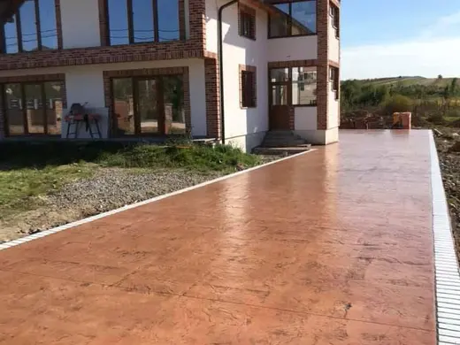 Stamped concrete with a continuous stone texture and no joints, photo 9