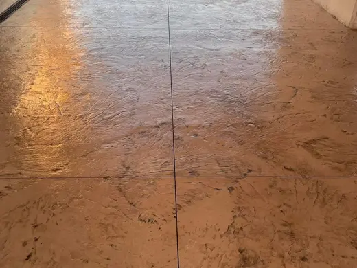 Stamped concrete with a continuous stone texture and no joints, photo 10